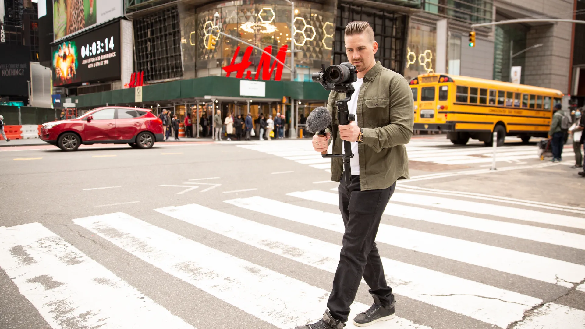 David Finlay filming in Times Square, New York