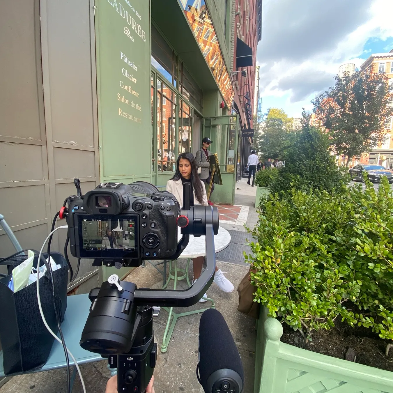 A real estate agent on camera on a NYC street during a Finlay Films agent listing video shoot