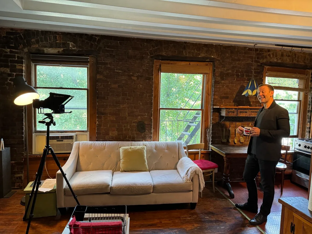 A Finlay Films branding shoot on location: teleprompter on a tripod, light, and the agent presenting to camera