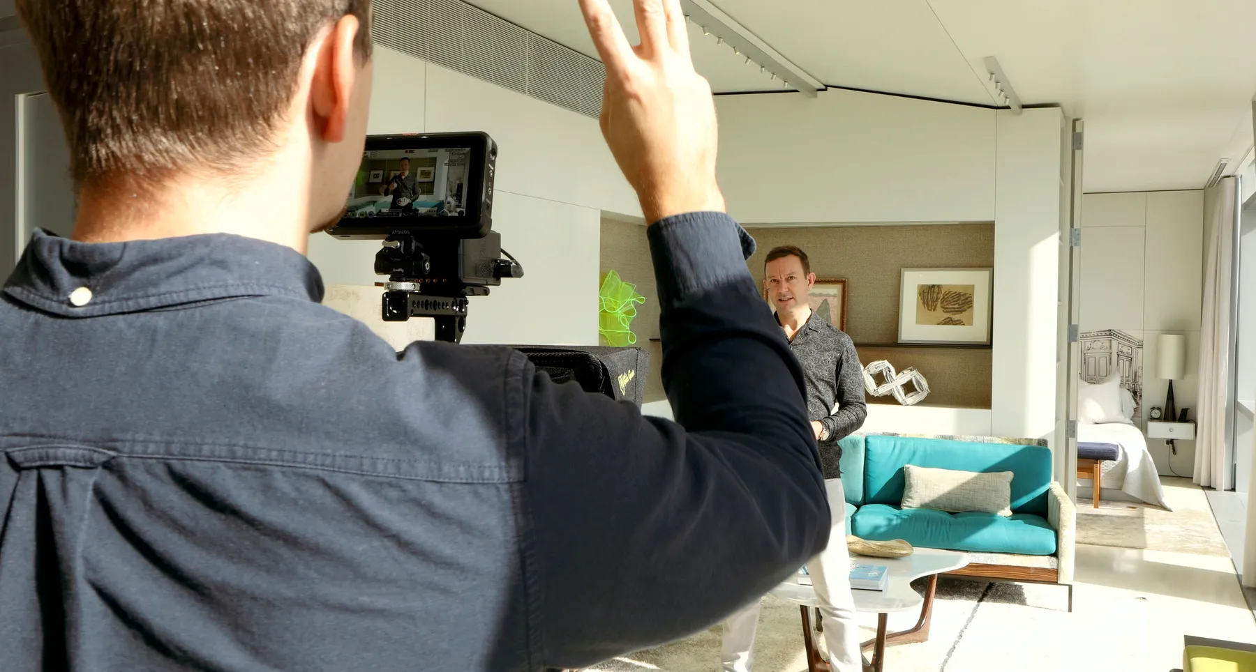 A full Finlay Films studio setup: multiple lights, two cameras, and the agent on set