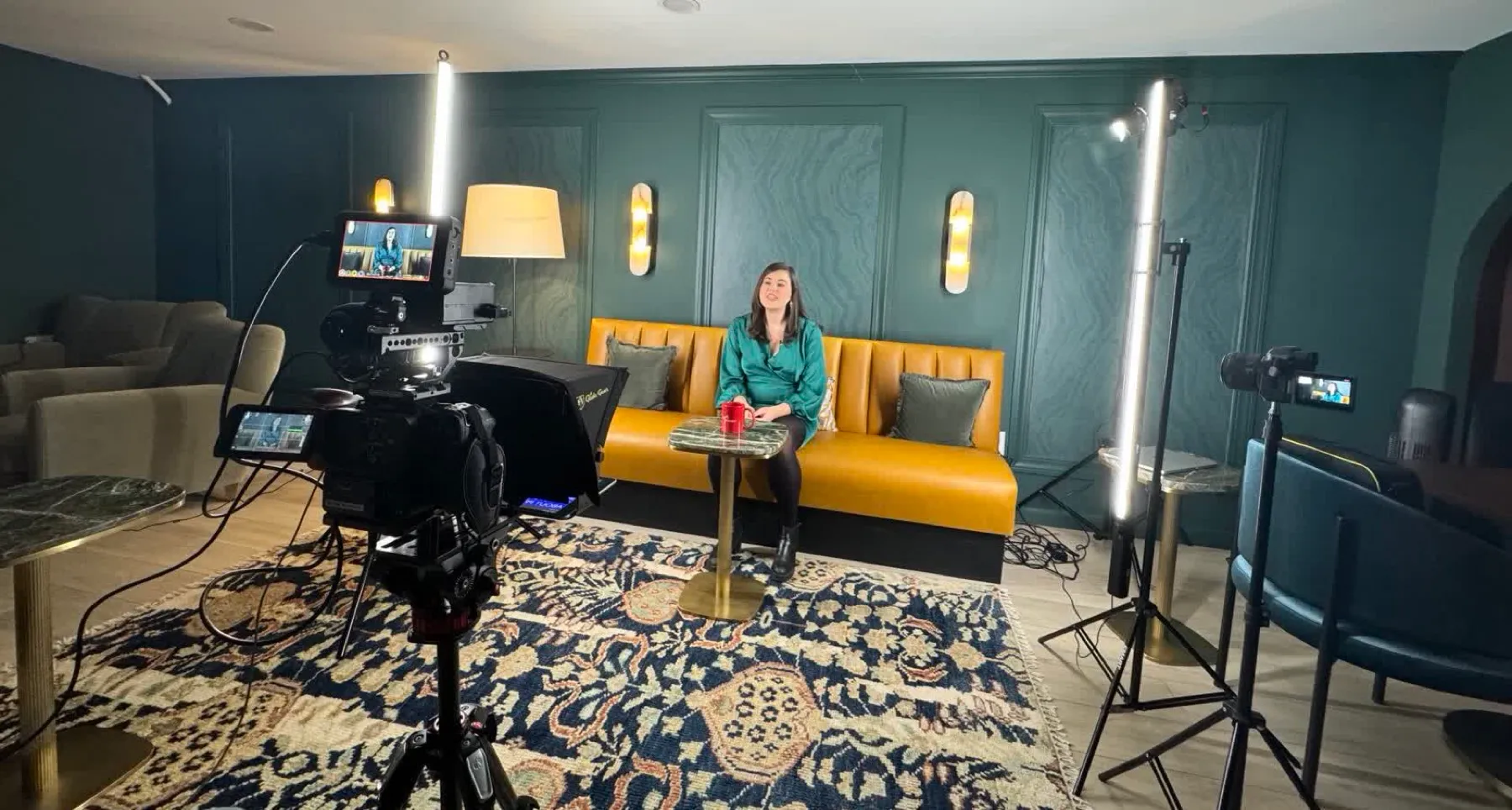 A full Finlay Films studio setup: multiple lights, two cameras, and the agent on set