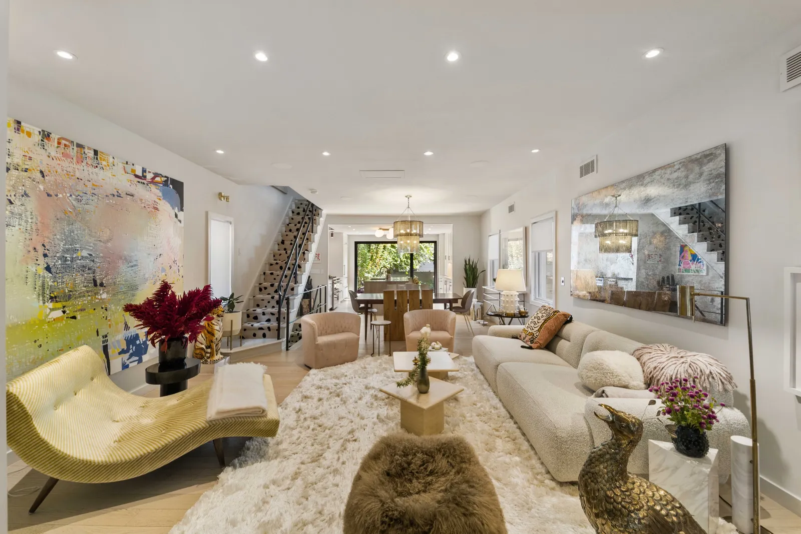 Bright art-filled living and dining room shot by Finlay Films